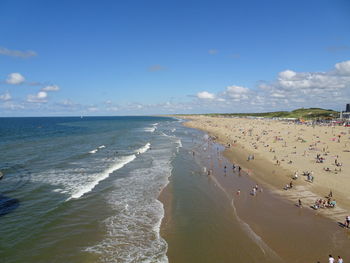 High angle view of people at beach against sky