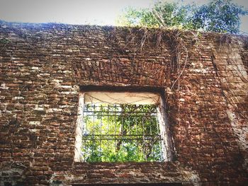 Low angle view of brick wall