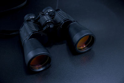 High angle view of binoculars on black background