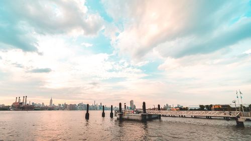 Panoramic view of river and buildings against sky