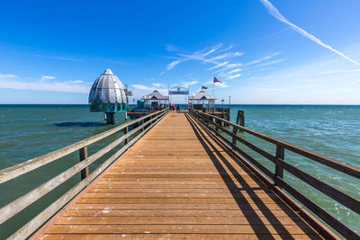 Pier over sea against sky