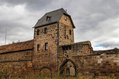 Low angle view of old building against sky