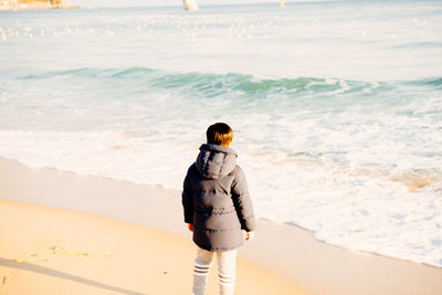 Woman walking on beach