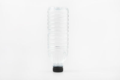 Close-up of wineglass against white background