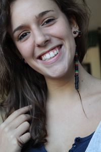 Close-up portrait of a smiling young woman