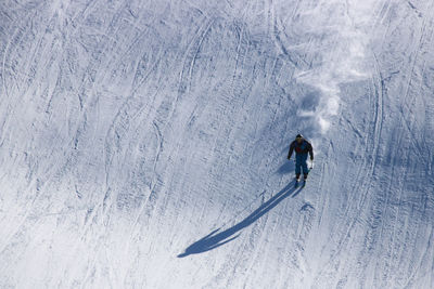 People skiing on snow covered field