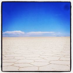 Scenic view of landscape against blue sky