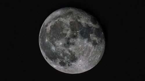 Close-up of moon against clear sky at night