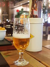 Close-up of beer in glass on table