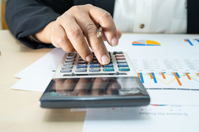 Midsection of person working on table