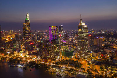 Aerial view of illuminated city buildings at night