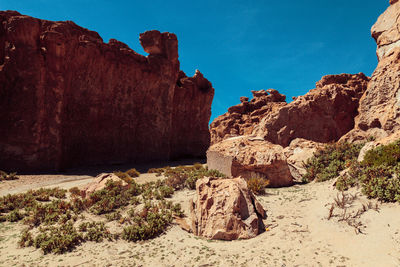 Rock formation on cliff against sky