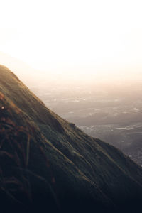 Scenic view of mountains against sky during sunset