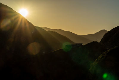 Scenic view of mountains against sky during sunset