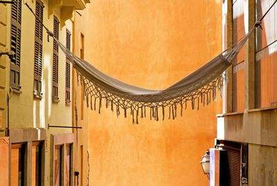 Hammock hanging amidst buildings