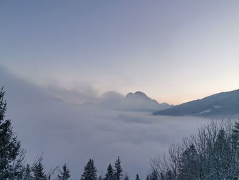 Scenic view of mountains against sky during sunset