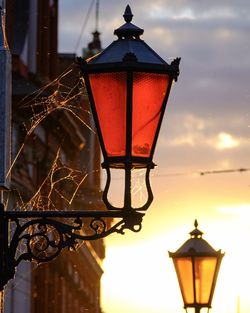 Low angle view of illuminated lamp on street light