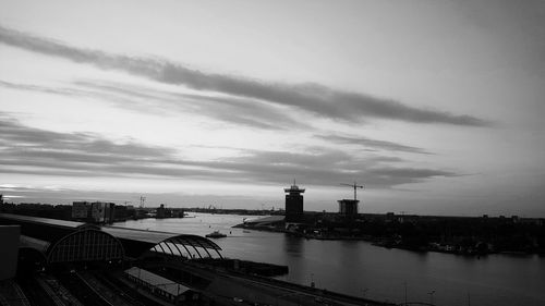 High angle view of cityscape against cloudy sky