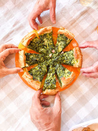 Cropped hand of woman holding food