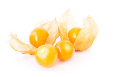 Close-up of fruits against white background