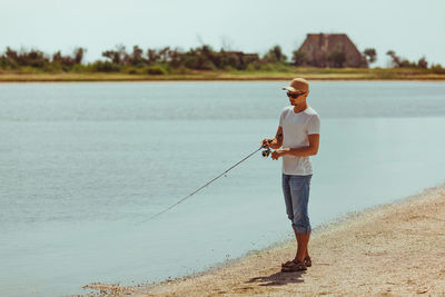 Full length of woman standing on shore