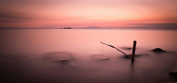 Reflection of sky in water at sunset