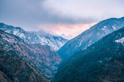 Scenic view of snowcapped mountains against sky