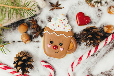 Christmas gingerbread cookie and decorations at christmas tree, gingerbread cup. high quality photo
