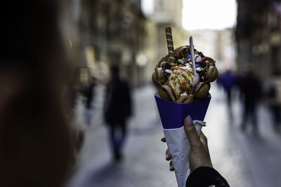 Close-up of person holding leaf