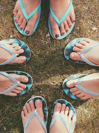 Low section of people standing on field