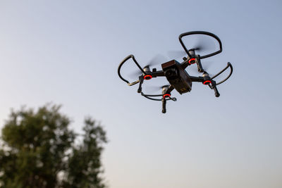 Low angle view of a drone against clear sky