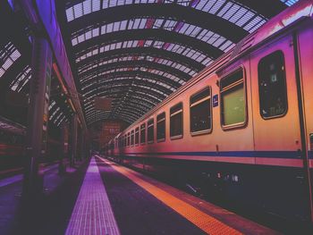 Train at illuminated subway station