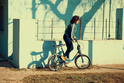 Woman using a vintage bicycle