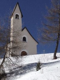 Building against sky during winter