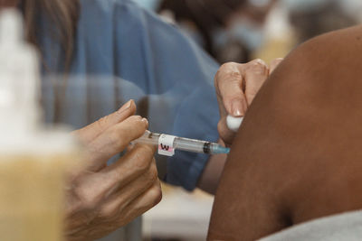 Nurse doing covid-19 vaccine injection