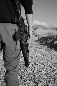 Rear view of man standing on mountain