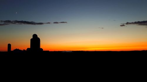 Silhouette landscape against sky during sunset