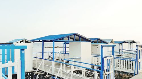 Built structure on beach against clear sky