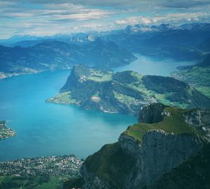 Aerial view of sea and mountains against sky