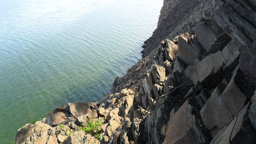 High angle view of rock formation at sea