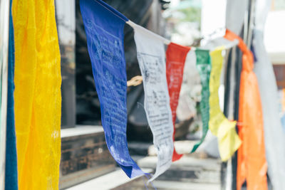 Multi colored flags hanging outdoors