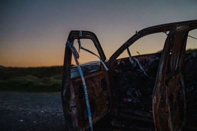 Burnt out car taped off by police in countryside 