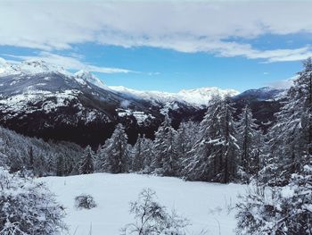 Scenic view of snowcapped mountains against sky