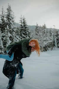 Full length of woman on snow covered land