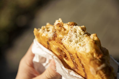 Close-up of hand holding ice cream