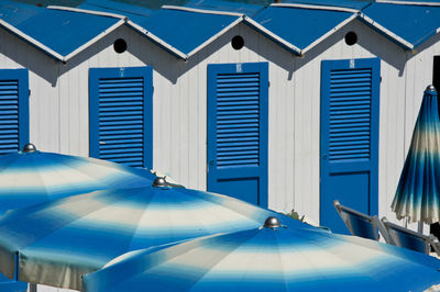 Modern buildings against blue sky on sunny day