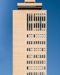 Low angle view of building against blue sky