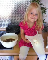 Portrait of cute girl sitting with ice cream