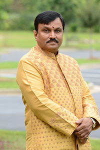 Portrait of man standing outdoors