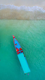 High angle view of man kayaking on sea against sky
